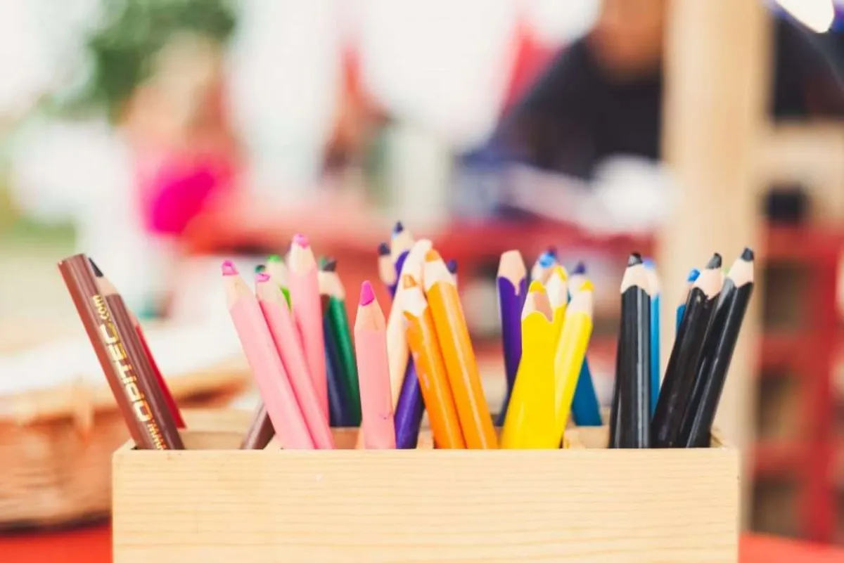 Colored pencils in a classroom, representing school partnerships.